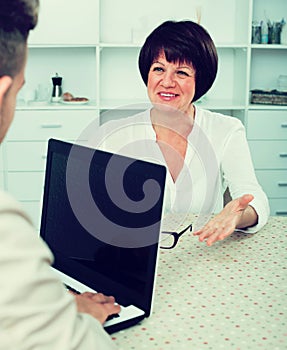 Young man and businesswoman communicate