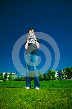 Young man with camcorder