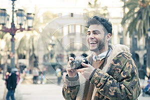 Young man with a camera