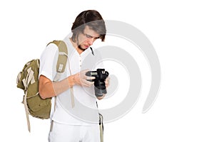 Young man with a camera in beach suit
