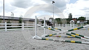 Young man canter at the manege