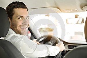 Young Man in a Car Rental Service Test Drive Concept