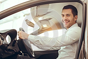 Young Man in a Car Rental Service Test Drive Concept