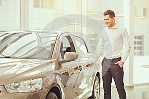 Young Man in a Car Rental Service Test Drive Concept