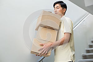 Young man carrying boxes