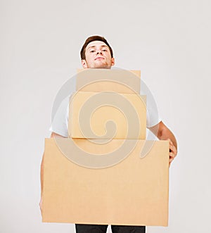 Young man carrying carton boxes