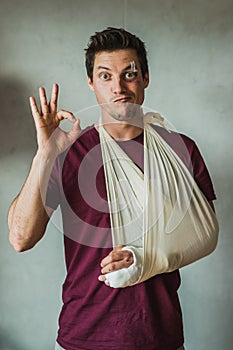 Injured man showing OK sign