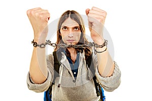 Young man with chained hands.