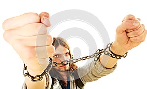 Young man with chained hands.