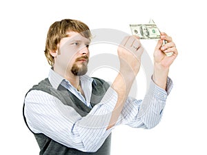 Young man checking dollars