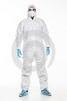 Young man in chemical protective suit making stop gesture on white background. Virus research