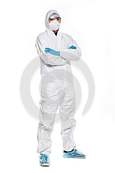 Young man in chemical protective suit making stop gesture on white background. Virus research