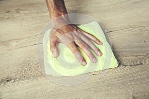 Man cleaning table