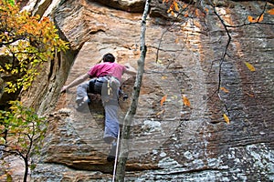 Young man climbing