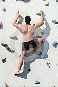Young Man Climbing Wall Rock Outdoors
