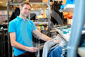 Young man in the clothes shop