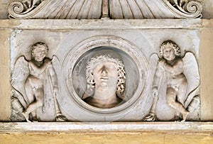 Young man of the Colonna family, flanked by a pair of cupids with downturned torches, church dei Santi XII Apostoli in Rome