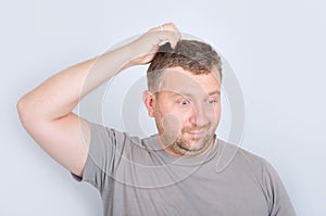 Young man with confused expression