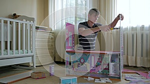 Young Man Construct Toy House