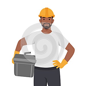 Young man construction worker in helmet and uniform, man with toolkit and diy tools photo