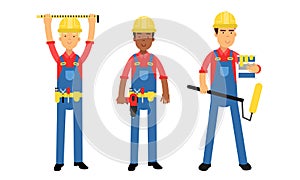 Young Man Constructor in Yellow Hard Hat and Blue Overall Holding Paint Roller and Measurement Tool Vector Illustration