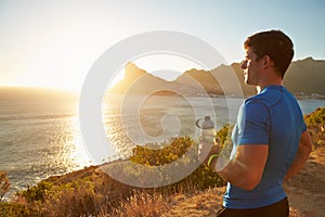 Young man contemplating after jogging