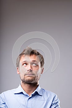 Young man with a contemplative expression