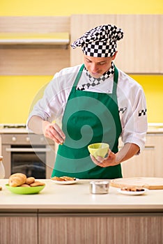 The young man cook preparing cake in kitchen at home