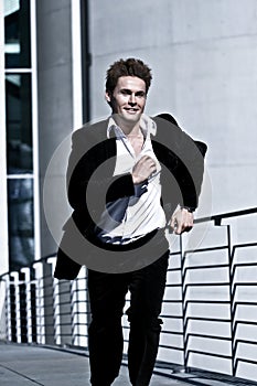 Young Man In Corporate Attire Running