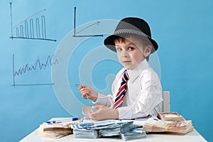 Young man, counting money and taking notes
