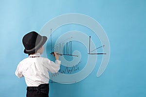 Young man, counting money and taking notes