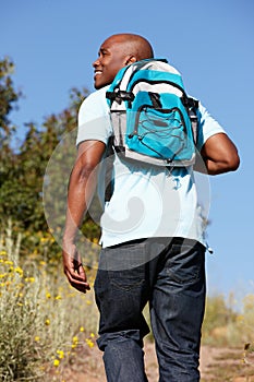 Young man on country hike