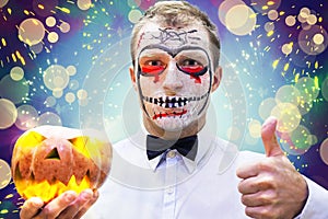 Young man on crazy Halloween party. Portrait of man in mask on holiday Halloween.