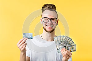 Young man credit card dollar bills freelance