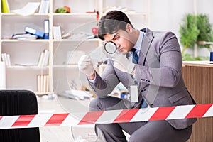 The young man during crime investigation in office