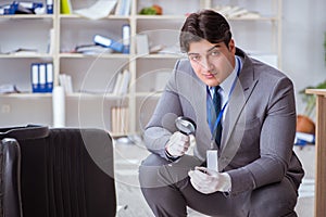 The young man during crime investigation in office