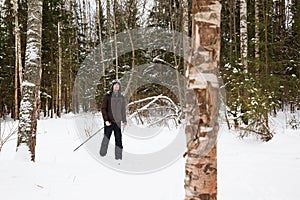 Young man cross-country skiing in the forest