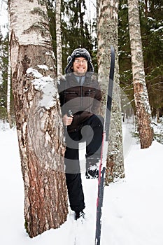 Young man cross-country skiing in the forest