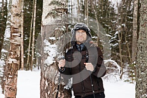 Young man cross-country skiing in the forest