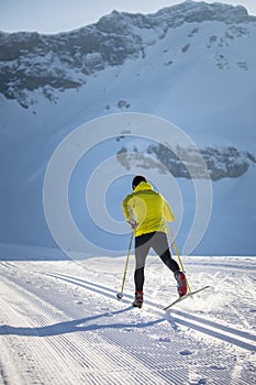 Young man cross-country skiing on a winter day