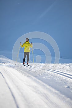 Young man cross-country skiing on a winter day