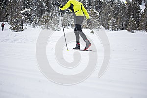 Young man cross-country skiing on a winter day