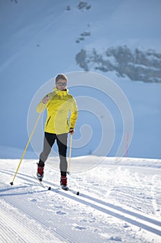 Young man cross-country skiing on a winter day