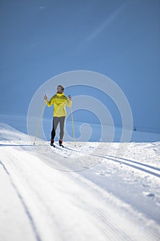 Young man cross-country skiing on a winter day