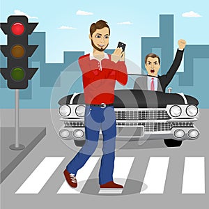 Young man crossing street sending sms while angry driver in black convertible car yelling at him