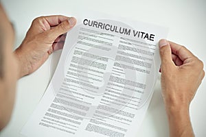 Young man with a curriculum vitae