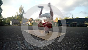 Young man dancing breakdance on the street