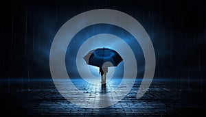 Young man with dark blue umbrella walking in the rain with copy space for text or graphics