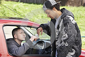 Young Man Dealing Drugs From Car