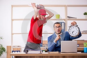 Young man delivering pizza to the office in time management conc